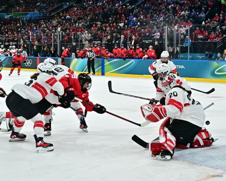 Ice hockey-Canada look to captain Poulin in title defence after goal-scoring record