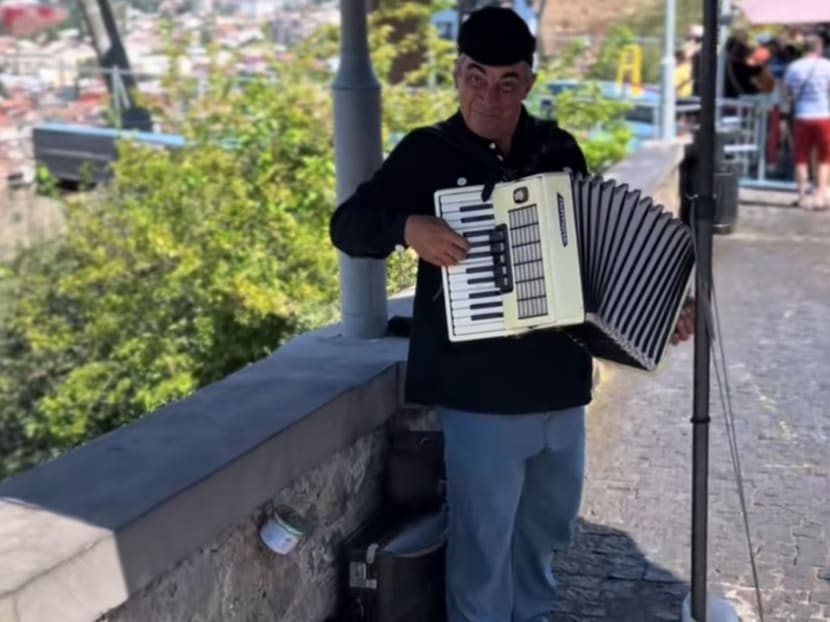 Street busker in Georgia gives Singapore couple surprise treat by playing Majulah Singapura