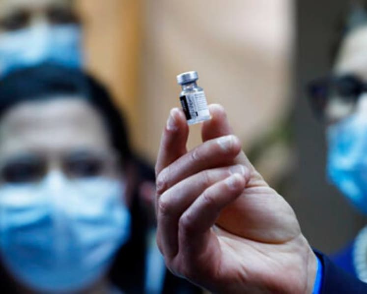 Israel begins COVID-19 inoculation drive as infections surge