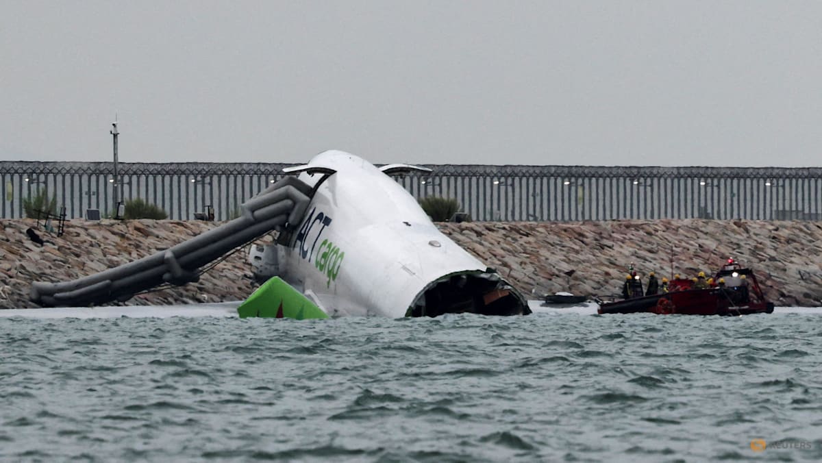 Cargo plane slides off runway in Hong Kong, airport operator says