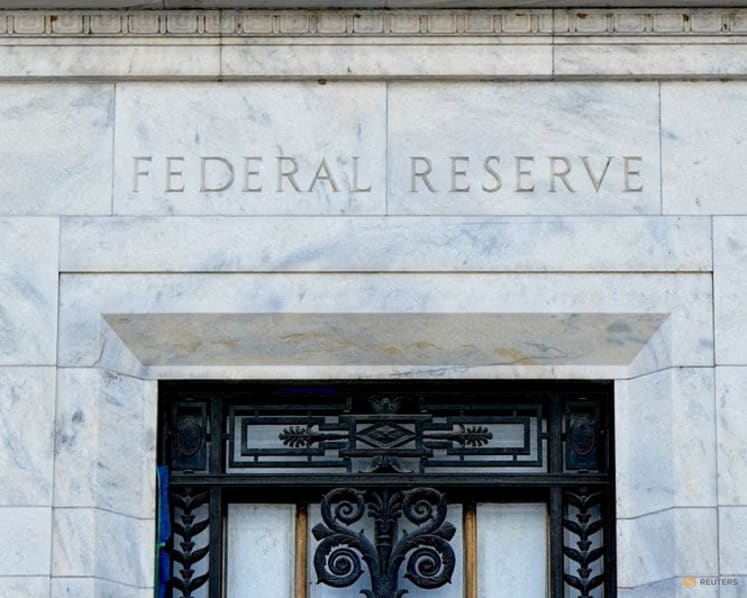Dollar slips as Fed holds rates steady