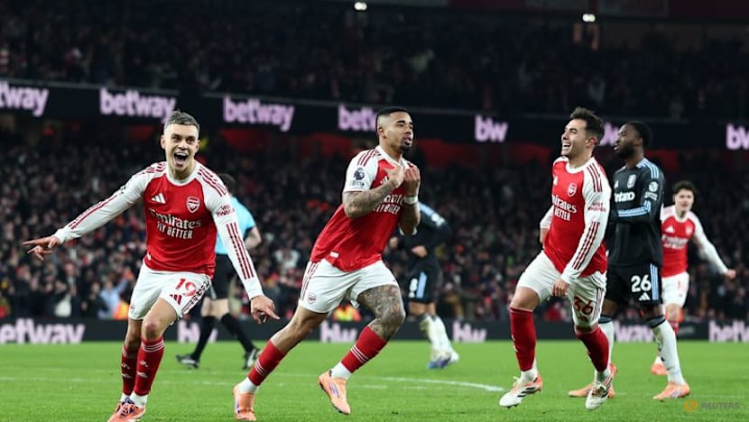 Arsenal halt Villa charge to stay clear in title race