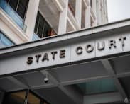 Two people convicted of false trading in shares of luxury car distributor 