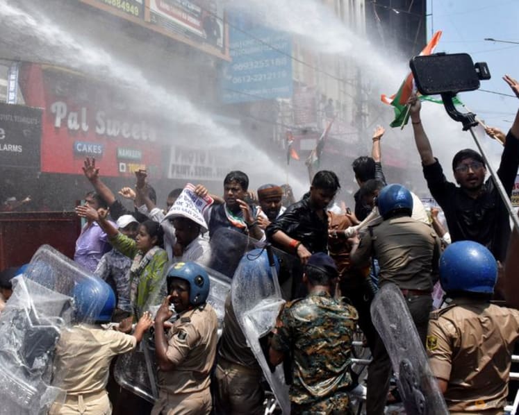 Indian police use water cannon at new protest over test paper leaks