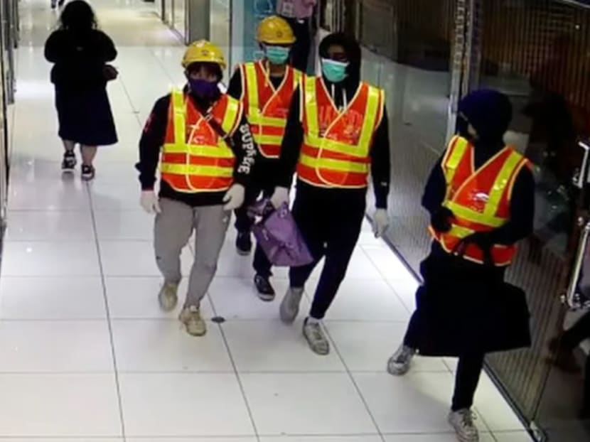 The four men dressed as construction workers who stole HK$10 million (S$1.7 million) worth of luxury watches in a raid on a store in Tsim Sha Tsui, Hong Kong.