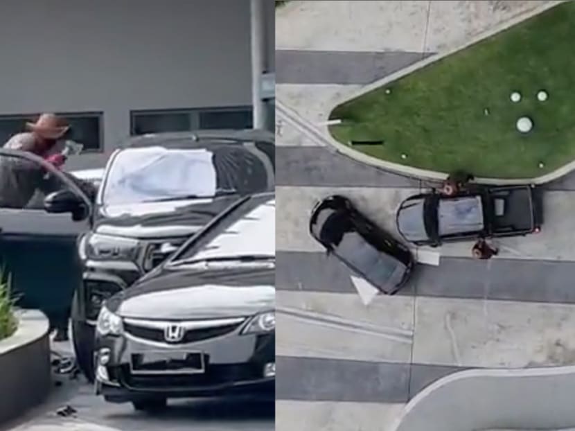 Screenshots from a video circulating on social media shows armed robbers attacking a driver at Puteri Harbour in Johor on March 13, 2023. Screenshots from a video circulating on social media shows armed robbers attacking a driver at Puteri Harbour in Johor on March 13, 2023.