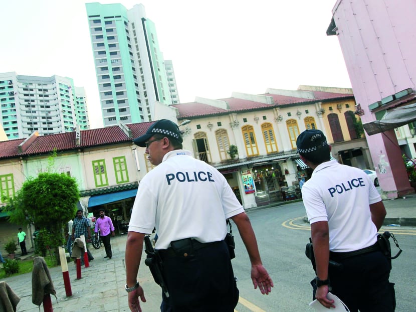 Police officers patrolling Little India the day after the Little India riot. Photo: Don Wong