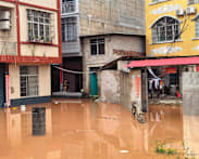 Homes submerged, tens of thousands relocated in China's south as flooding intensifies