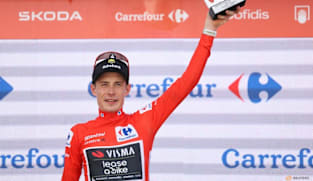 Cycing-Vingegaard celebrates Vuelta win in car park, atop drinks cooler
