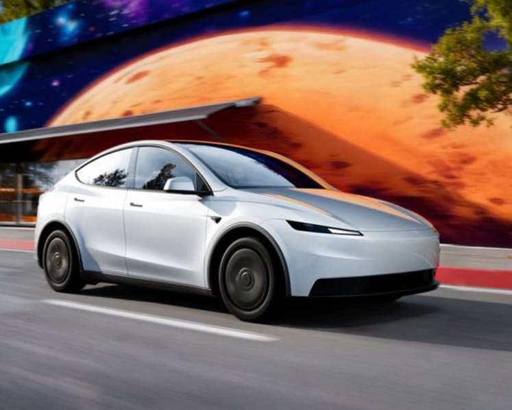 Tesla profit falls short despite record sales, hit by higher costs and fading credits