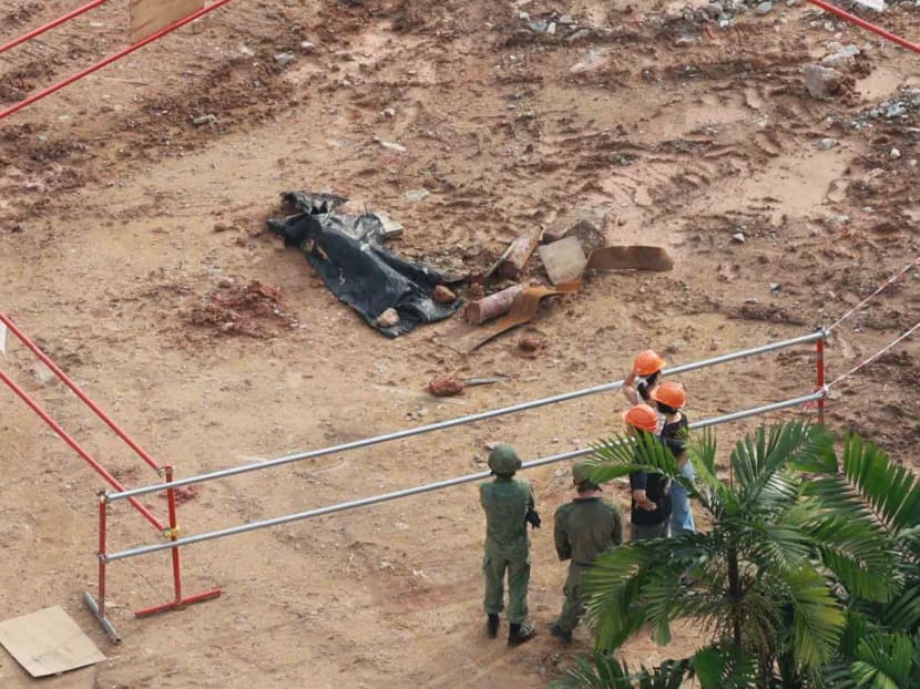 A war relic, seen here covered by a black tarp on Sept 25, 2023, was found during excavation works at a construction site at 800 Upper Bukit Timah Road. 