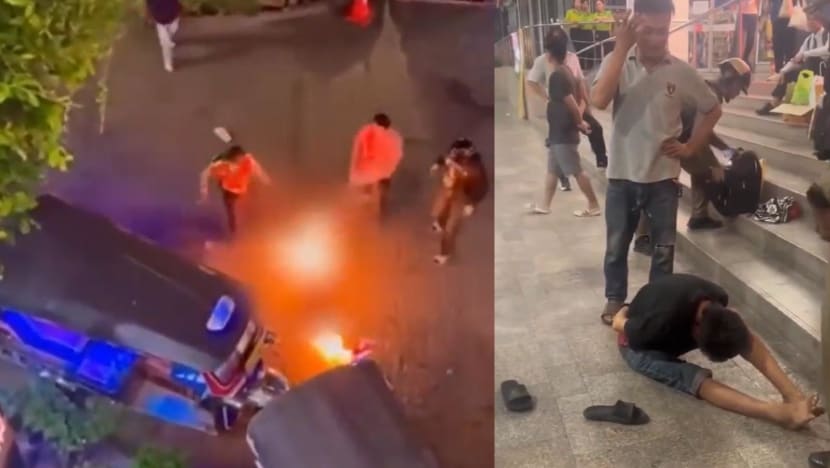 Two Malaysian tourists set on fire in downtown Bangkok; suspect in custody Two Malaysian tourists set on fire in downtown Bangkok; suspect in custody