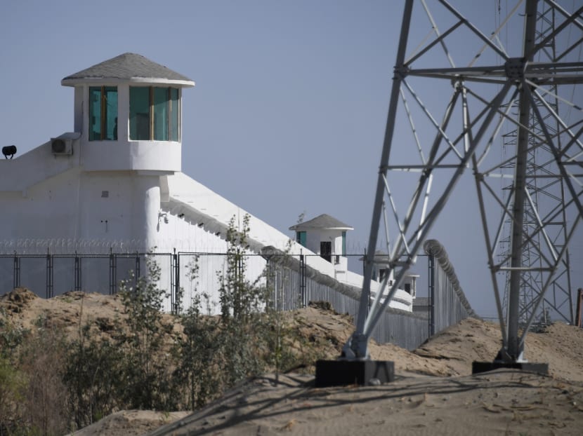 This file photo taken on May 30, 2019 shows watchtowers on a high-security facility near what is believed to be a re-education camp where mostly Muslim ethnic minorities are detained, on the outskirts of Hotan, in China's northwestern Xinjiang region. This file photo taken on May 30, 2019 shows watchtowers on a high-security facility near what is believed to be a re-education camp where mostly Muslim ethnic minorities are detained, on the outskirts of Hotan, in China's northwestern Xinjiang region.