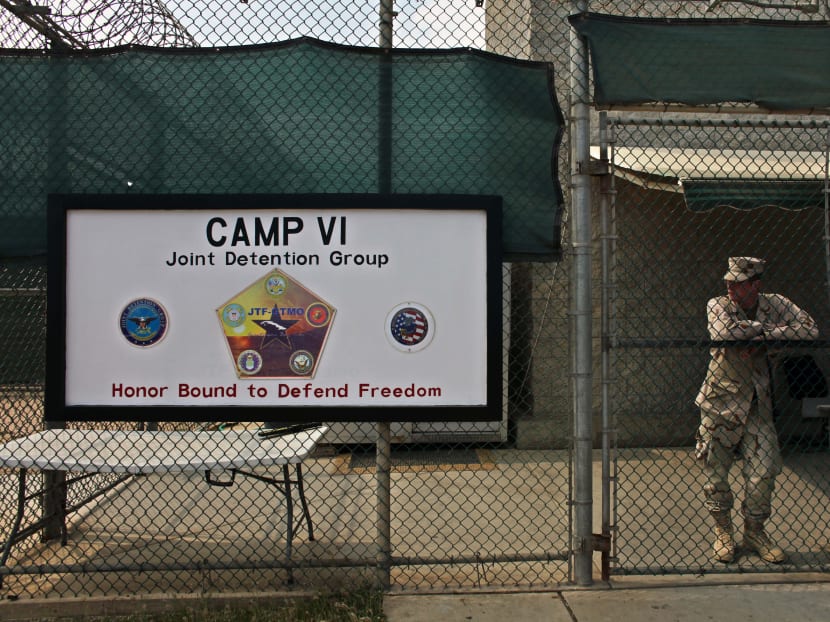 A soldier stands guard at the front gate entrance to Guantanamo's Camp 6 maximum-security detention facility, at Guantanamo Bay US Naval Base, Cuba. AP file photo