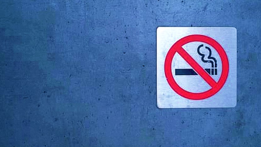 Man swung beer bottle at NEA officer who caught him smoking, gets 11 weeks’ jail