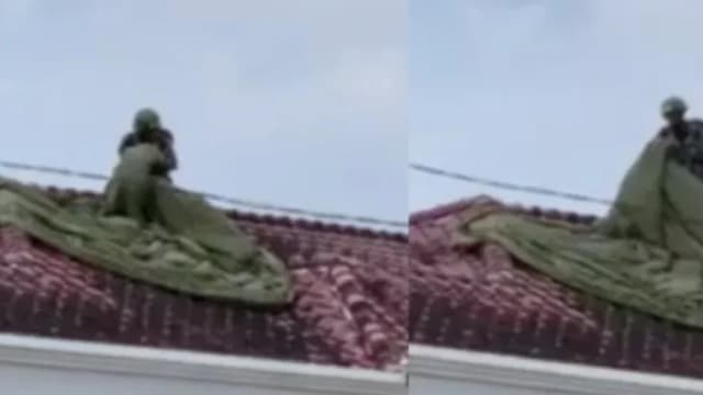 马国军人跳伞演习迫降毁屋顶 屋主：没事就好