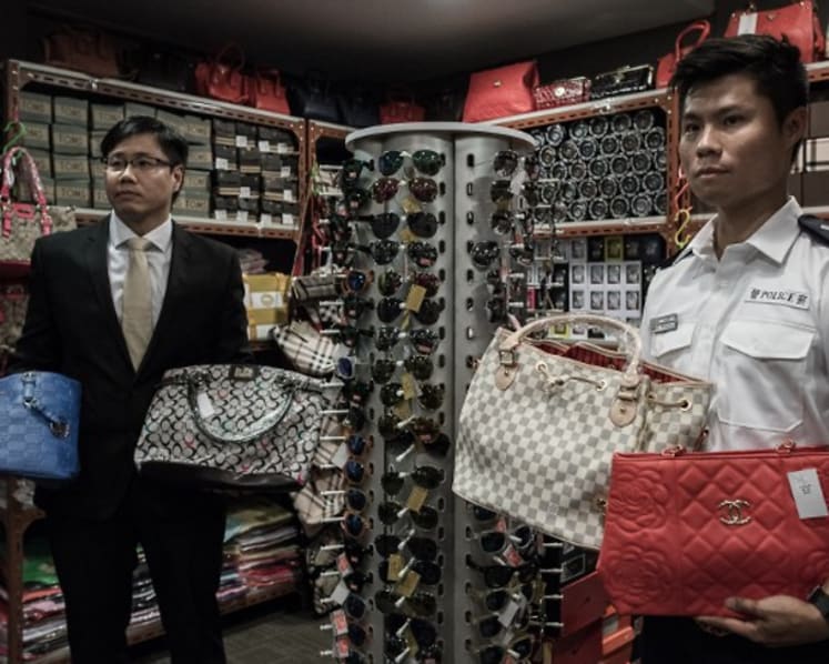 Commentary: Who on earth still buys counterfeit branded goods?