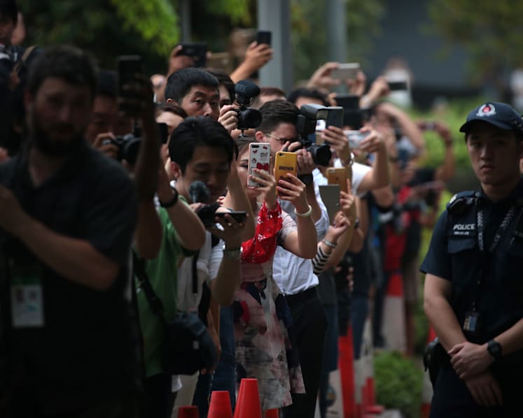 Curious onlookers hanging around entrance to Sentosa for glimpse of historic Trump-Kim summit