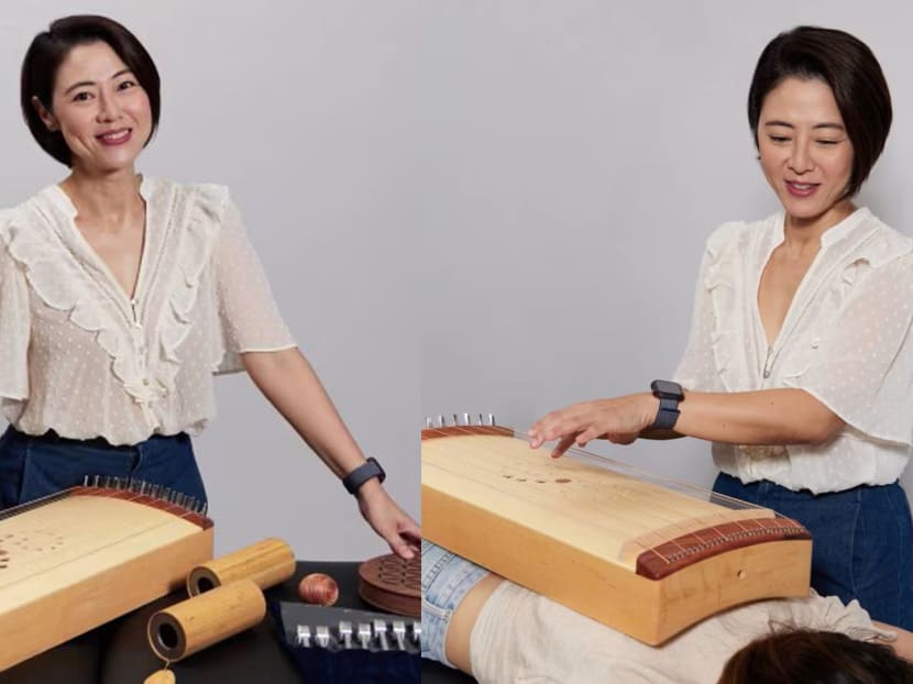 Cynthia Koh played a musical instrument on our body when we went for her sound therapy treatment…and it was good