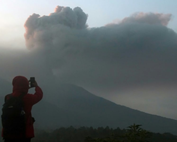 Visiting volcanoes big business in Indonesia but safety in spotlight after several eruptions including Marapi