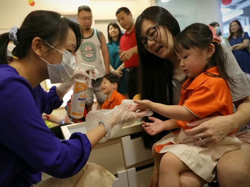 Temperature checks were kicked up a notch at entrances to preschools and parents were told to fill in forms declaring their recent travels.