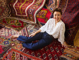 This passionate collector of vintage tribal rugs uses them to style her home in Singapore