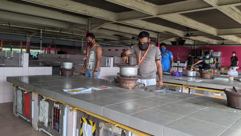 Migrant workers get back to cooking and daily runs after communal activities resume in dorms
