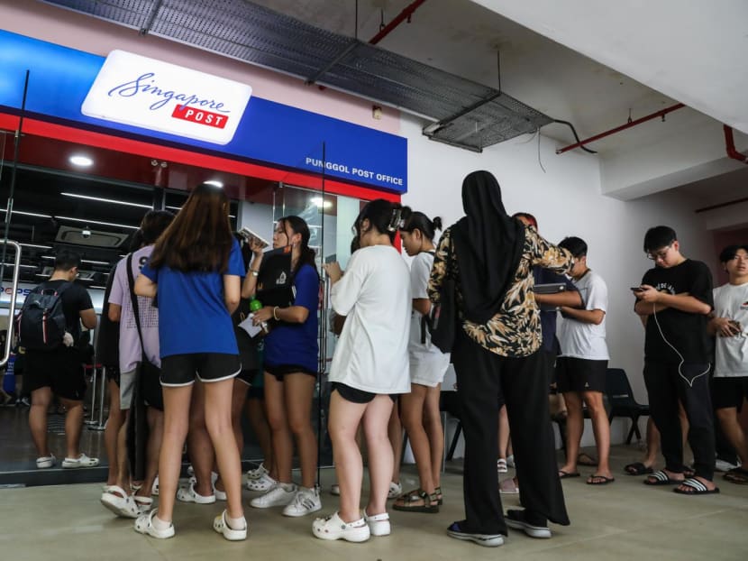 Fans seen queueing at a SingPost outlet in Punggol on July 7, 2023.