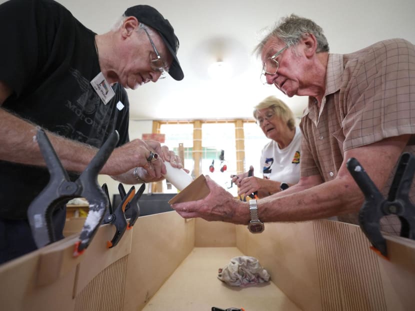This photo taken on Feb 27, 2024 shows members of the coffin club working on coffins during a work day at the Coffin Club’s workshop in Hastings. This photo taken on Feb 27, 2024 shows members of the coffin club working on coffins during a work day at the Coffin Club’s workshop in Hastings.