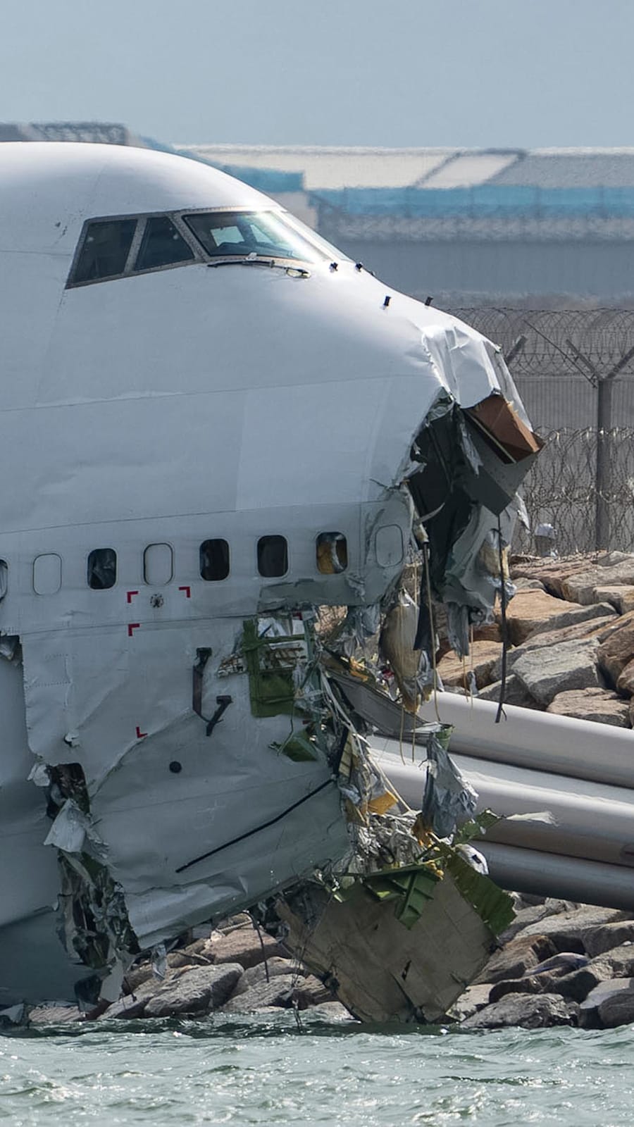 Cargo plane slides off runway in Hong Kong, leaving two dead 