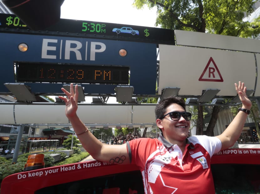 Joseph Schooling on the open top bus during the victory parade on Aug 18, 2016. Photo: Jason Quah