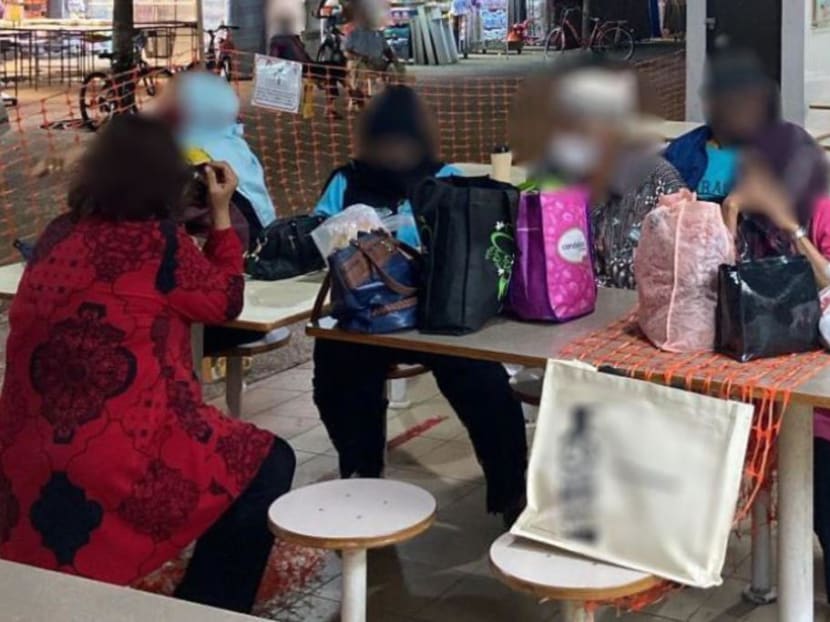 A gathering of more than two people seen at the Haig Road Market and Food Centre.