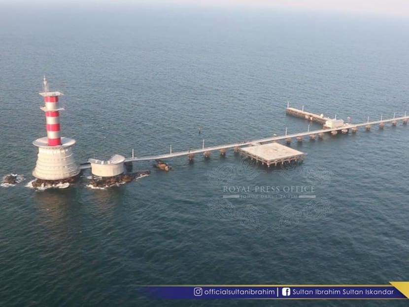 The Abu Bakar Maritime Base, built across the uninhabited features at the eastern opening of the Strait of Singapore, comprises a 316m jetty, a helipad, and a lighthouse. Photo: Royal Press Office of Johor Darul Ta'zim