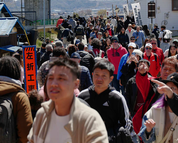 Japanese town sours on crowds coming to see cherry blossoms, Mount Fuji