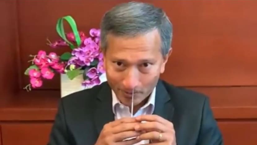 In a Facebook video, Vivian Balakrishnan demonstrates how quickly pre-event testing might be done
