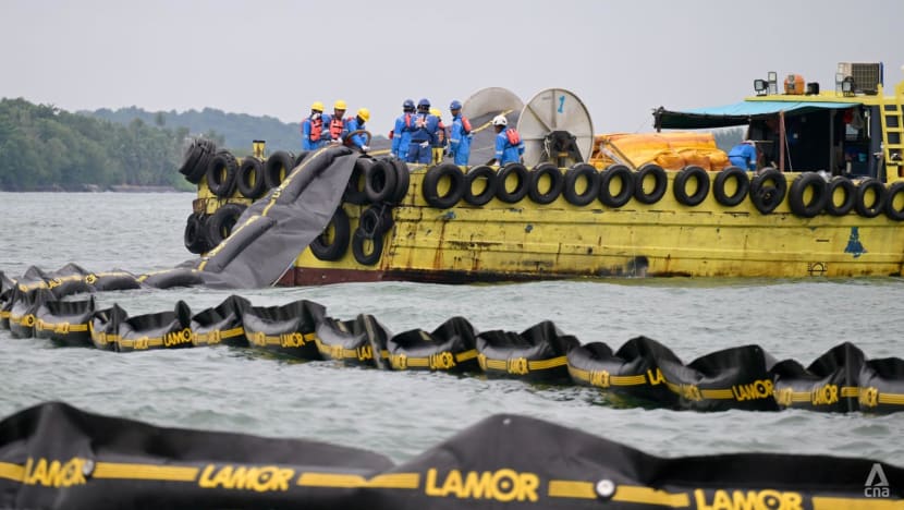 Repairing snapped booms, treating oil-slicked sand: Oil spill clean-up efforts continue a week on Repairing snapped booms, treating oil-slicked sand: Oil spill clean-up efforts continue a week on