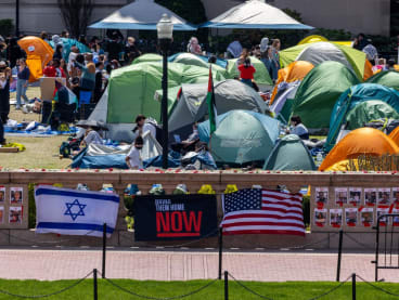 Posters and flags honoring Israeli hostages kidnapped on Oct 7 are displayed on a ledge near the pro-Palestine encampment at Columbia University on April 24, 2024 in New York City. 