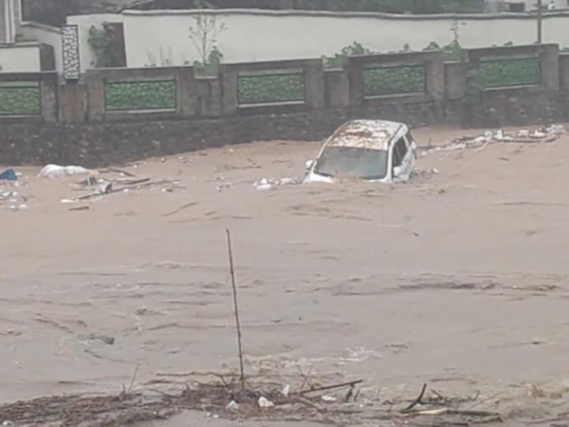 A vehicle is swept by the floodwaters following heavy rainfall in Jiangwan, Guangdong, China in this screengrab taken from a social media video released on April 22, 2024. A vehicle is swept by the floodwaters following heavy rainfall in Jiangwan, Guangdong, China in this screengrab taken from a social media video released on April 22, 2024.