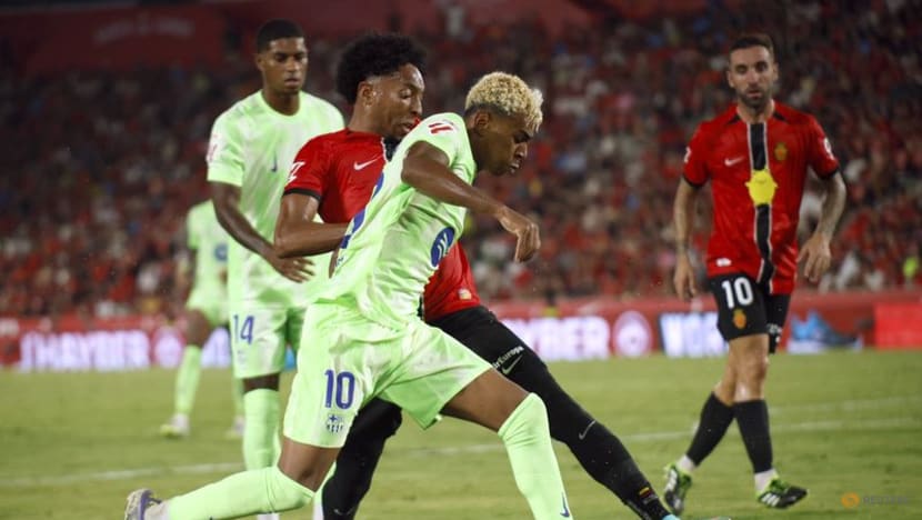 Champions Barcelona ease to opening win at Mallorca