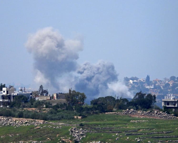 Israeli strikes kill 14 in Lebanon as Israel warns residents to leave towns beyond 'buffer zone'