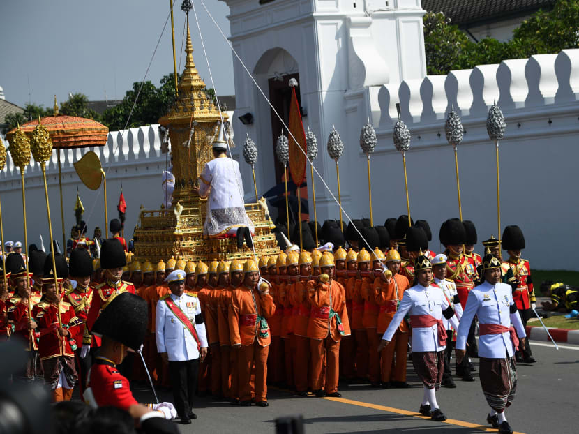 The Royal Urn is transported during the funeral procession for the late Thai king Bhumibol Adulyadej in Bangkok. A sea of black-clad mourners massed across Bangkok's historic heart early on October 26 as funeral rituals began for King Bhumibol Adulyadej, a revered monarch whose passing after a seven-decade reign has left Thailand bereft of its only unifying figure. Photo: AFP