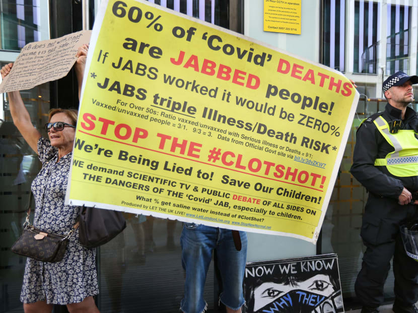 Anti-vaccine protesters hold placards expressing their opinion on Covid-19 vaccines during a demonstration on Sept 8.