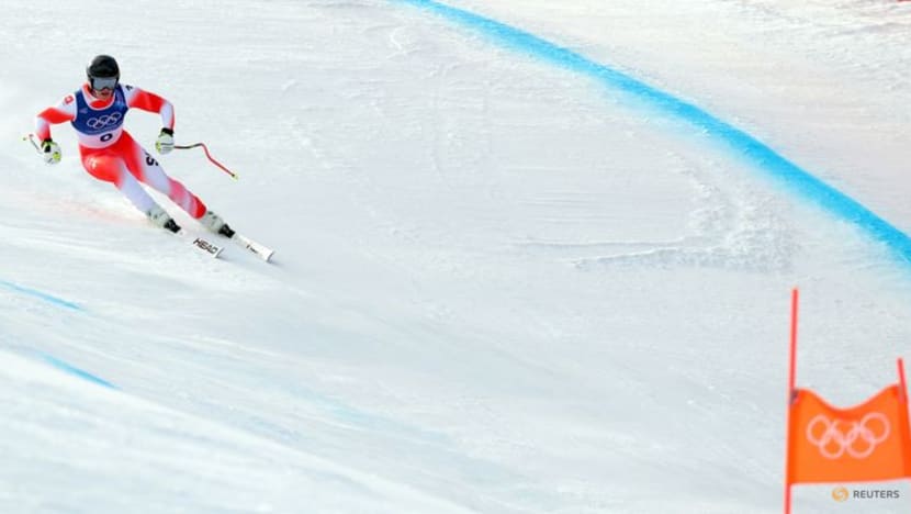 Alpine skiing-Von Allmen strikes gold again with more than a little help from his friend