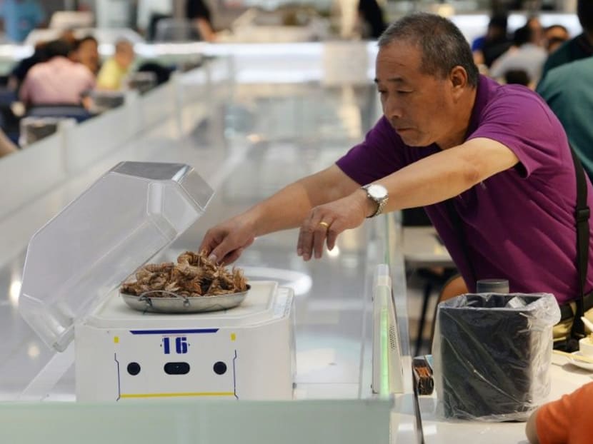 Raising efficiency and lowering labour costs are the objectives at Alibaba's "Robot.He" diners, where waiters have been replaced by robots about the size of microwave ovens, which roll around the dining room on table-high runways.