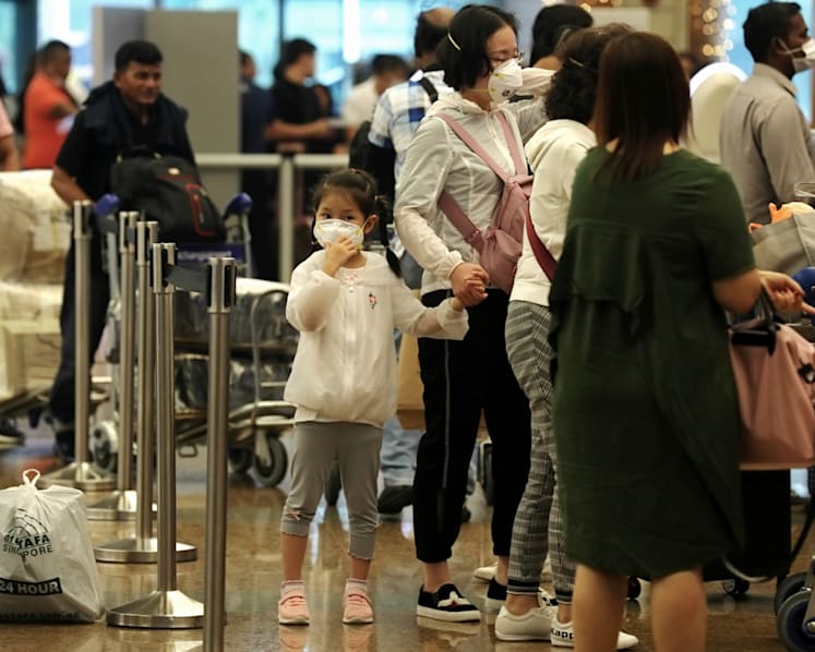 Employers must seek approval from MOM for work pass holders returning to Singapore after travel to China
