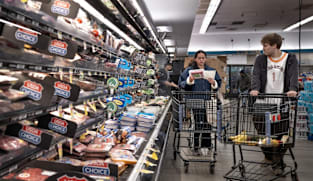 US revises first quarter growth down while inflation climbs