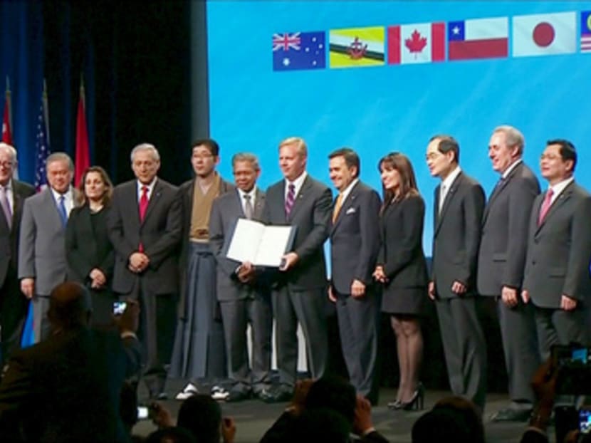 Trade ministers and officials from the 12 TPP member nations at the signing ceremony in Auckland yesterday. Singapore’s Minister for Trade and Industry, Lim Hng Kiang, is third from right. Photo: Reuters Trade ministers and officials from the 12 TPP member nations at the signing ceremony in Auckland yesterday. Singapore’s Minister for Trade and Industry, Lim Hng Kiang, is third from right. Photo: Reuters