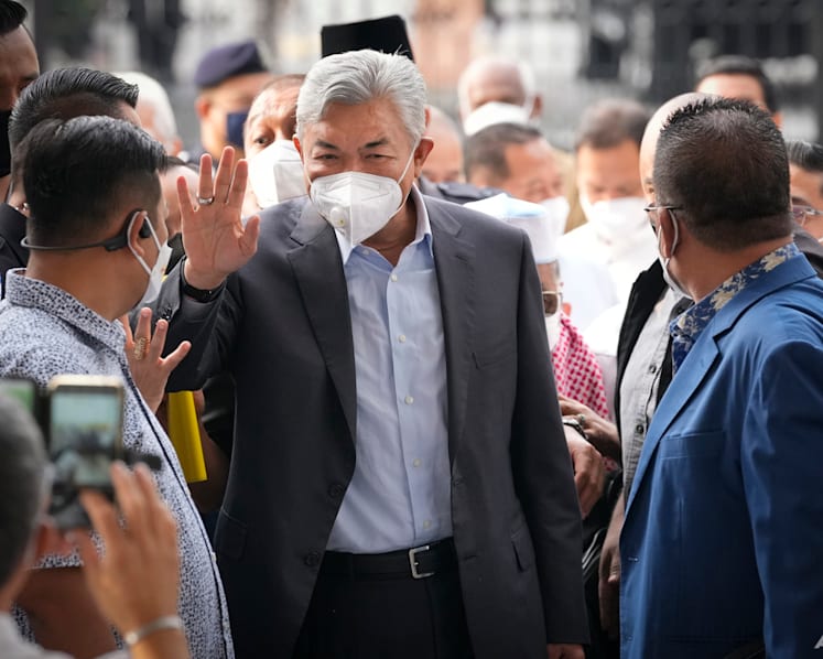 UMNO president Ahmad Zahid ordered to enter defence on corruption, money laundering charges