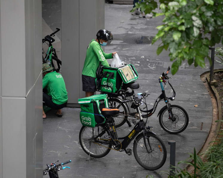 URA urges malls to have waiting bays for delivery riders, who say they often park illegally to save time