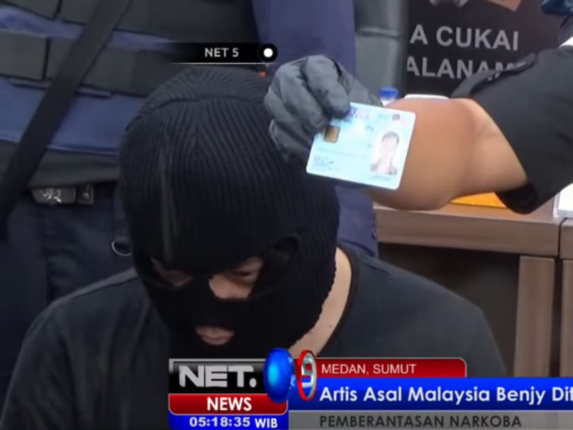 Malaysian actor Benjy being held by Indonesian police. Photo: Screengrab from Official NET News